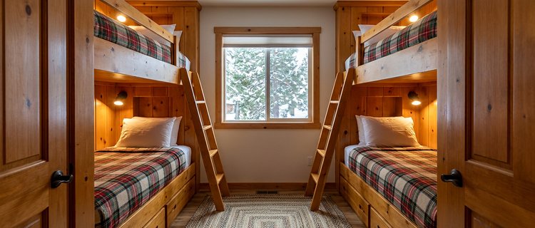 Bunk room with four built-in beds in a Big Bear rental cabin, adding sleepers within the occupancy cap