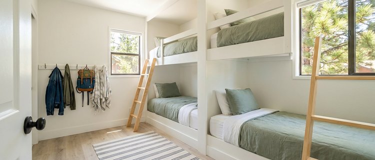 Bunk room with built-in beds and washable bedding, a durable way to furnish a Big Bear cabin for family groups