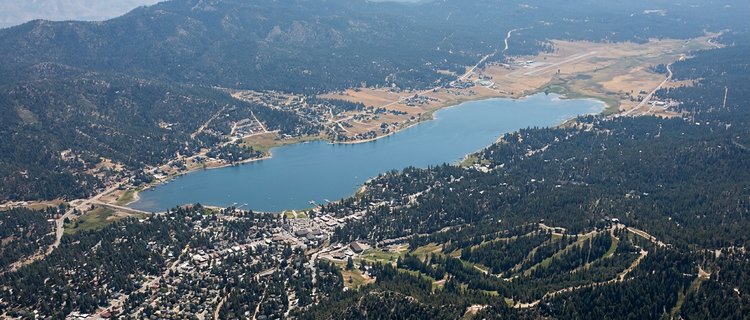 Aerial view of Big Bear Valley showing the lake, the City of Big Bear Lake on the south shore, and the unincorporated County communities around it